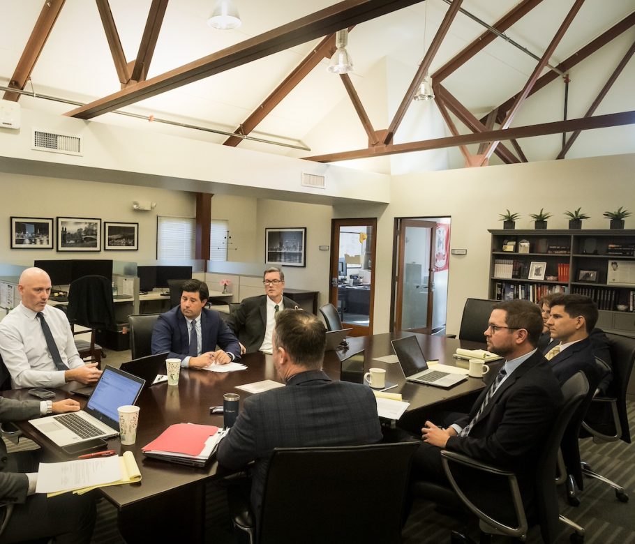 employees sitting around conference table